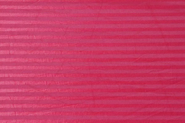 Red abstract lined fabric background