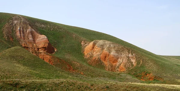 Mountain slopes with green grass panorama — Stock Photo, Image