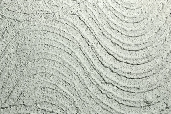 rough wavy plaster on wall texture - beautiful abstract photo background