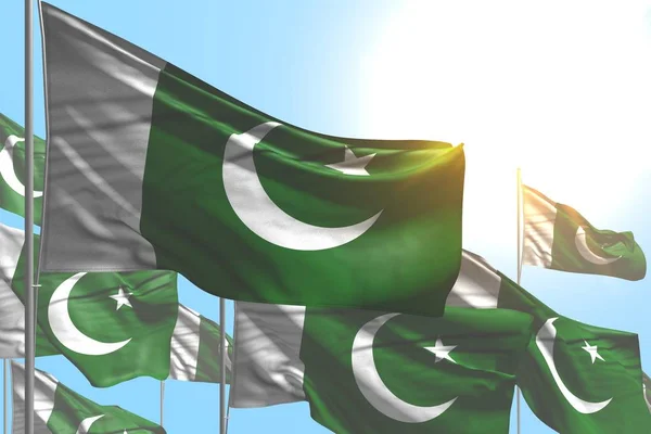 Hermosas banderas de Pakistán muchas ondean sobre fondo azul cielo - cualquier celebración bandera 3d ilustración —  Fotos de Stock