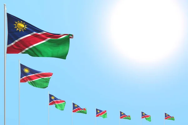 Schattig veel Namibië vlaggen geplaatst diagonaal op blauwe hemel met plaats voor tekst - elke feestvlag 3d illustratie — Stockfoto