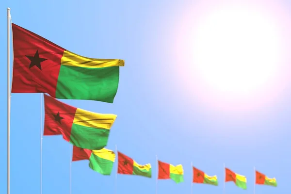 Ganska många Guinea-Bissau flaggor placerade diagonal med mjuk fokus och fritt utrymme för din text - någon firande flagga 3D-illustration — Stockfoto