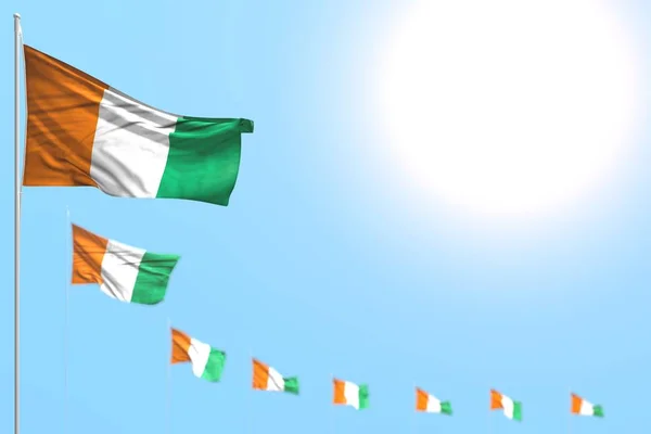 Merveilleux de nombreux drapeaux Côte d Ivoire placés en diagonale avec bokeh et place vide pour le texte - n'importe quel drapeau de fête illustration 3D — Photo