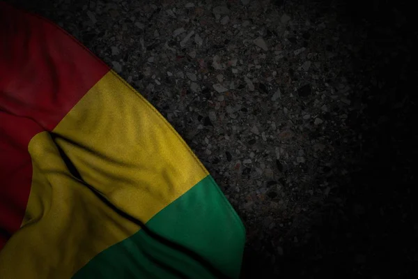 Beautiful dark illustration of Guinea flag with big folds on dark asphalt with free place for text - any celebration flag 3d illustration — ストック写真