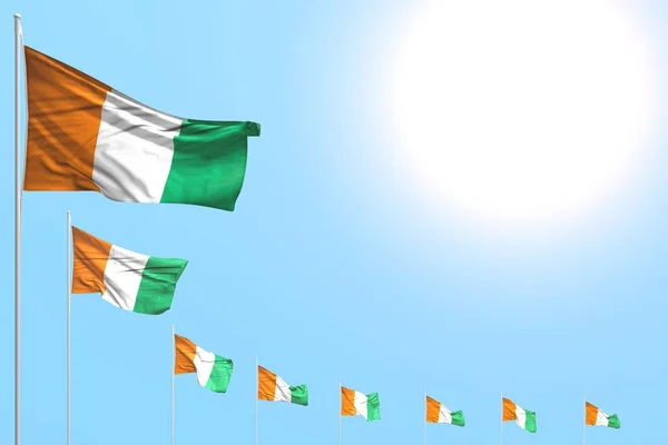 Beautiful many Cote d Ivoire flags placed diagonal on blue sky with space for your text - any celebration flag 3d illustration — Stock Photo, Image