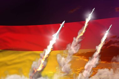 Günbatımında modern stratejik roket kuvvetleri konsepti, Almanya süpersonik savaş başlığı saldırısı - askeri endüstriyel 3D illüstrasyon, bayrağı olan nükleer bomba
