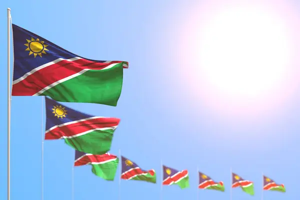 Prachtige vele Namibië vlaggen geplaatst diagonaal met zachte focus en vrije plaats voor inhoud - elke vakantie vlag 3d illustratie — Stockfoto