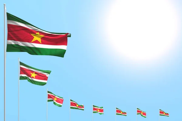 Beautiful many Suriname flags placed diagonal on blue sky with place for content - any feast flag 3d illustration — 스톡 사진