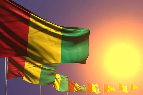 Ładne wiele Gwinea flagi umieszczone po przekątnej na zachód słońca z miejsca na tekst - każda flaga uroczystości 3d ilustracja — Zdjęcie stockowe