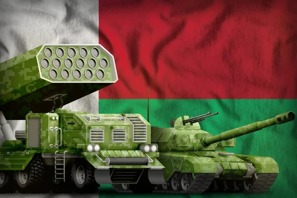 tank and missile launcher with summer pixel camouflage on the Madagascar flag background. Madagascar heavy military armored vehicles concept. 3d Illustration