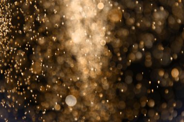 Harika turuncu renkli, bol miktarda uçan ışık saçan bokeh dokusu - soyut fotoğraf arkaplanı