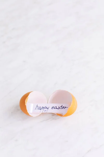 Broken eggshell with Happy Easter greeting card