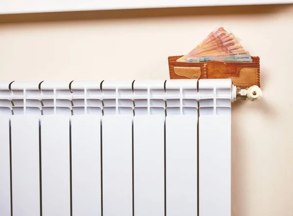 Radiator adjustment to save energy. Save energy and money concept