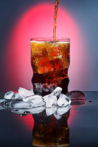 Cola in drinking glass with ice sweet sparkling carbonated drink beverage fast food with big calorie