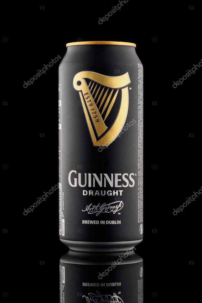 CHELYABINSK, RUSSIA - April 11,2018 Aluminum can of Guinness draught beer advertising shot on black background with realistic reflection Guinness beer one of the most successful beer brands worldwide popular Irish dry stout original traditionally bre