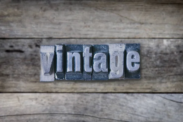 Vintage word on wooden table — Stock Photo, Image