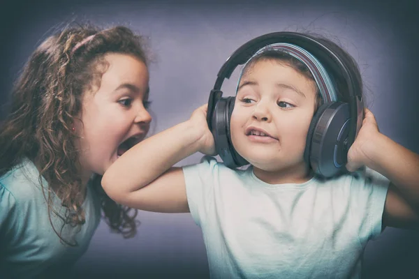 Cheerful kids with headphones — Stock Photo, Image