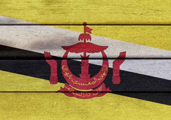 Bandera de la Nación de Brunei sobre superficie de madera —  Fotos de Stock