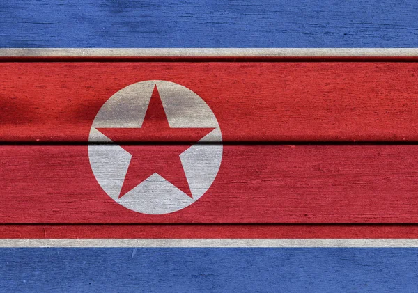 Bandeira da Coreia do Norte na superfície de madeira — Fotografia de Stock