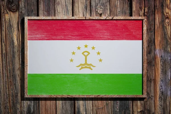 Деревянный флаг Таджикистана — стоковое фото