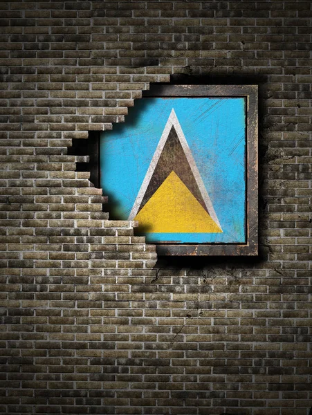 Old Saint Lucia flag in brick wall — Stock Photo, Image