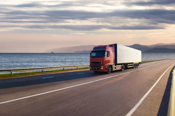 Truck on a road near the sea — Stock Photo, Image