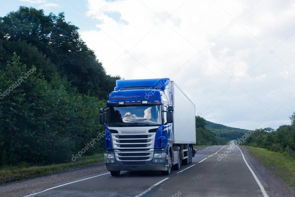 Blue truck on a road