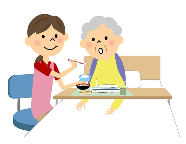 La anciana asistida por una enfermera de comida — Vector de stock