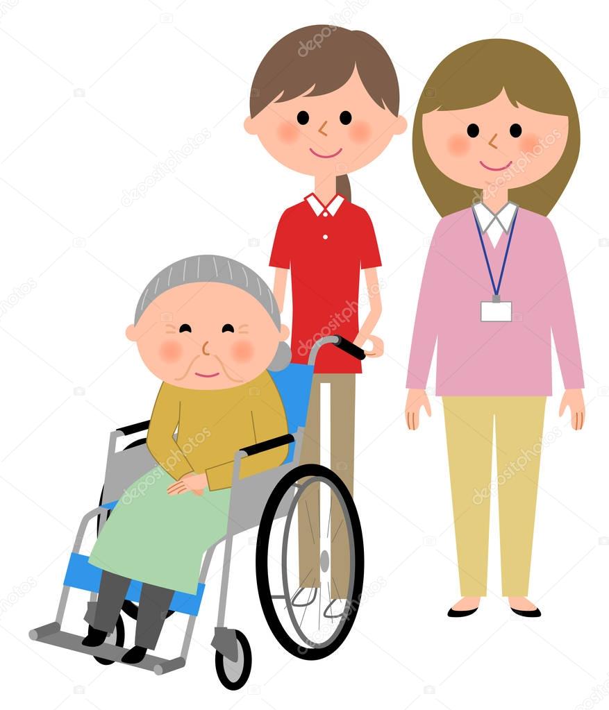 Elderly women sitting in a wheelchair and care giver
