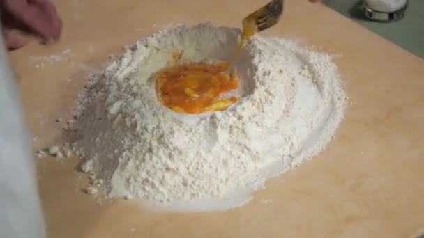 Mixed raw egg with flour Ingredients For Making Cookies, man Preparing Dessert. close-Up — Stock Video