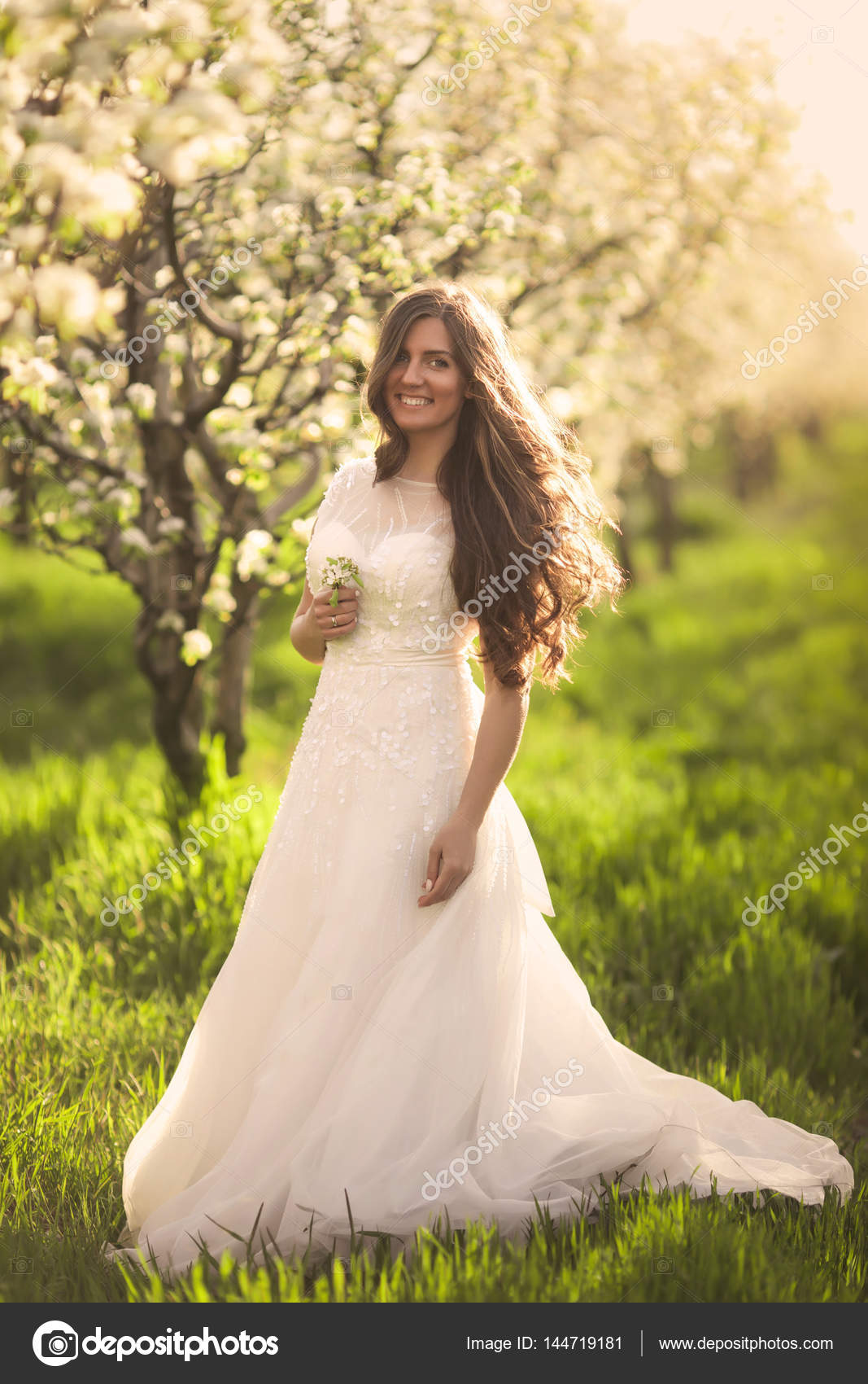 Portrait Of Beautiful Woman In Flowers The Bride In Ivory Wedding
