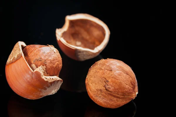 Hazelnuts on a black — Stock Photo, Image