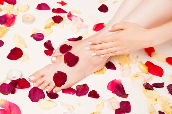 Female gentle hand laying on legs — Stock Photo, Image