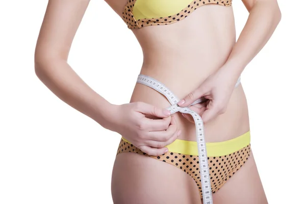 Mulher medindo seu corpo magro isolado — Fotografia de Stock