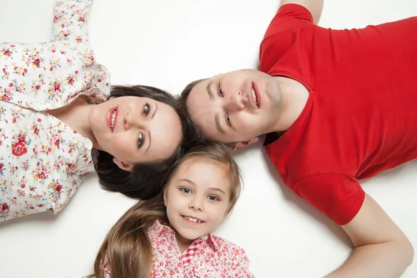 High angle portrait of happy family lying — Stock Photo, Image