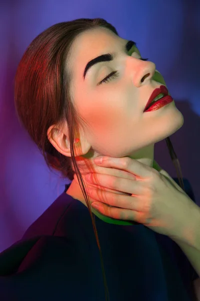 Attractive woman holding neck — Stock Photo, Image