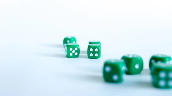 Green dices Close-up on a white background — Stock Photo, Image