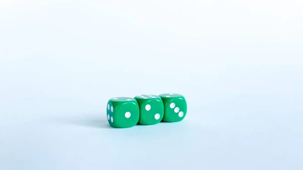 Green dices Close-up on a white background — Stock Photo, Image