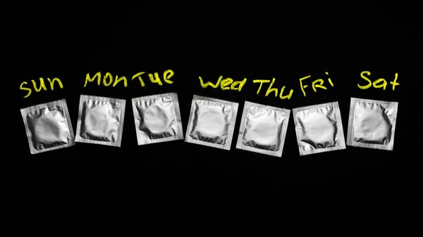Презервативы - семь дней в неделю — стоковое фото