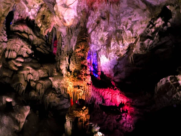 Beautiful cave with colored illumination — Stock Photo, Image