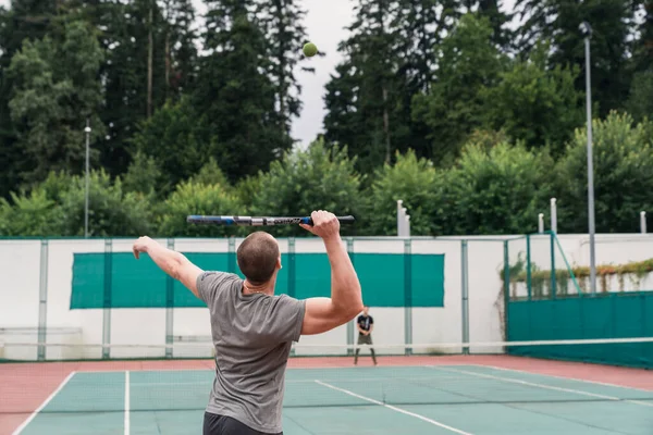 Athletic man on tennis training
