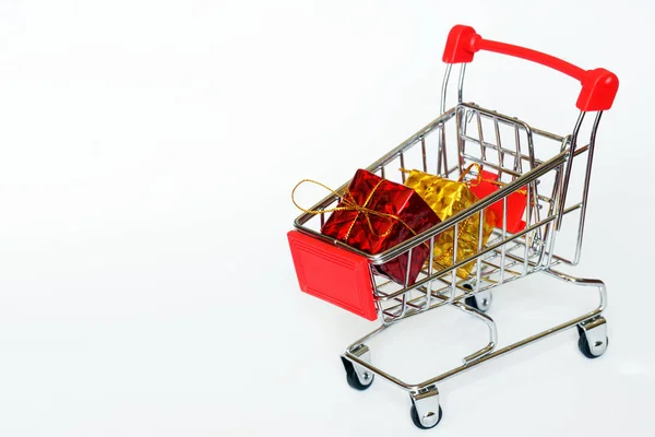 Carts from the supermarket with bright gift boxes. Seasonal and — 스톡 사진