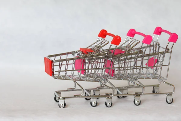 Three metal trolleys from the supermarket, assembled into one fo — 스톡 사진