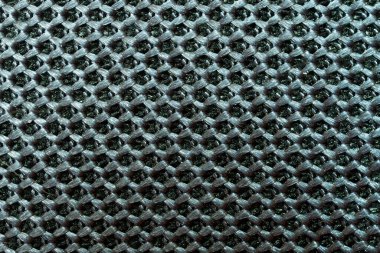 Örülmüş sentetik bir maddenin parçası. Tekrar eden bir deseni olan su geçirmez kumaş. Modern teknolojiler. Arkaplan ya da fon. Makro.                            