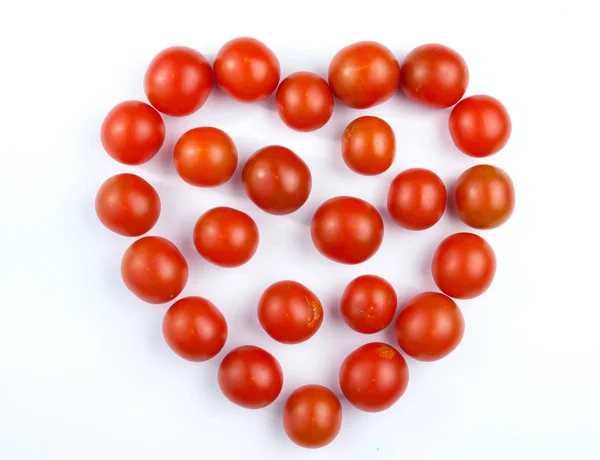 Tomatoes isolated on wood Stock Picture