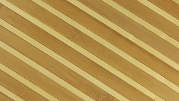 Textura de rotação e zoom de uma esteira de bambu . — Vídeo de Stock