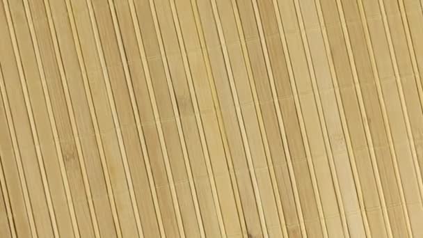 Tapete de bambu com zoom e rotação, textura de fundo para design . — Vídeo de Stock