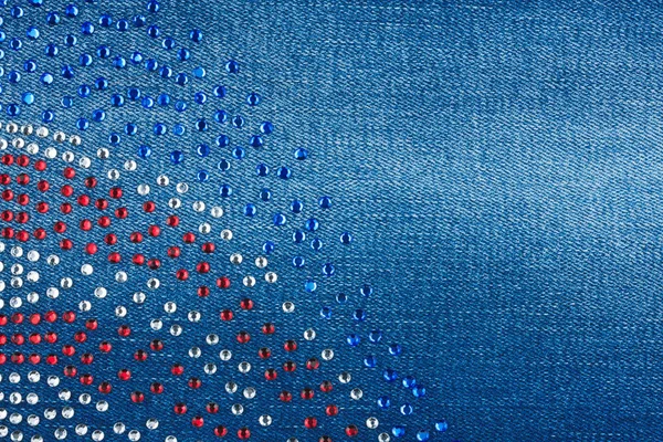 Denim fabric encrusted with crystals. Background, texture. — Stock Photo, Image