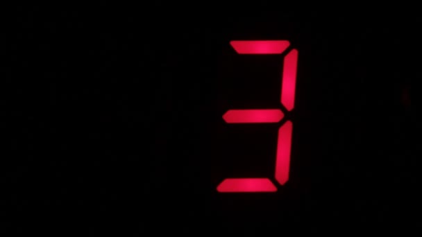 Digital clock countdown from zero to sixteen. Digital timer in red color over black background. — Stock Video