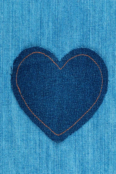 Classic heart made of denim lies on a denim. Space for text. — Stock Photo, Image